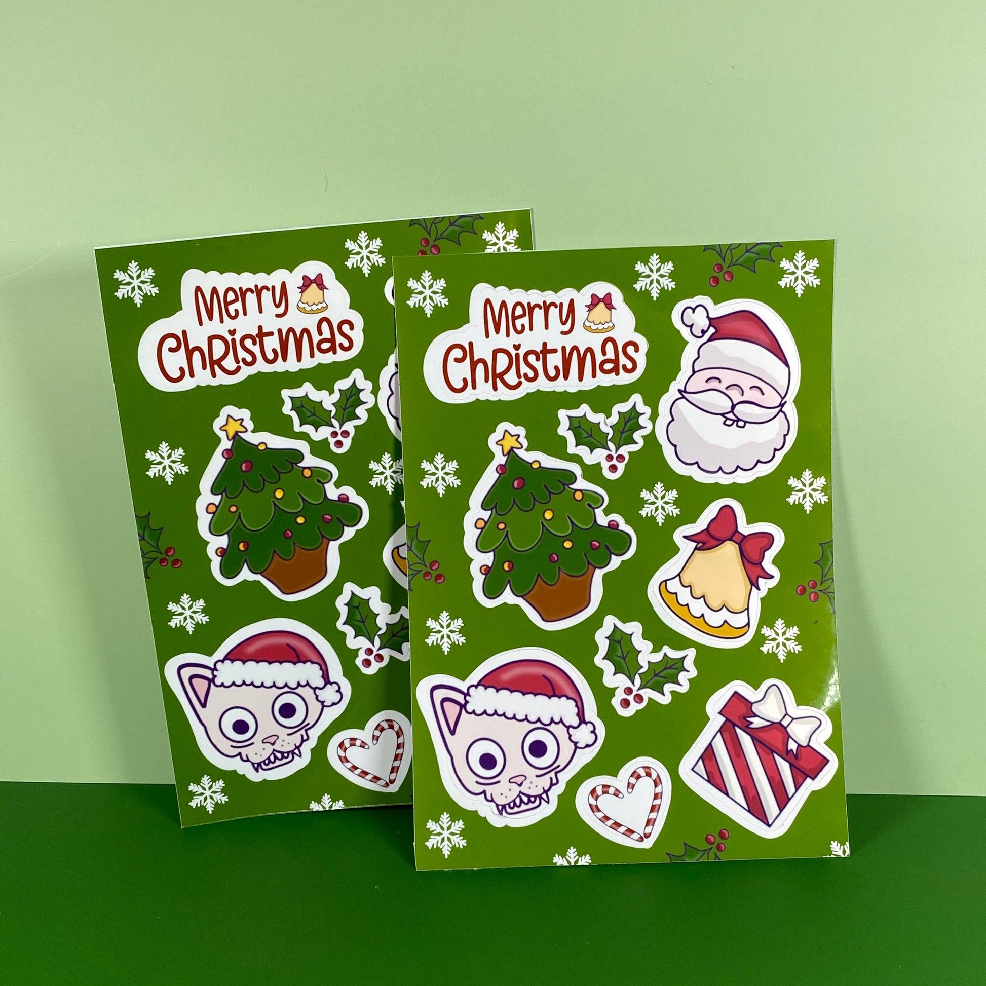 Green Christmas-themed sticker sheet with Santa Claus, reindeer, and trees on a green background.